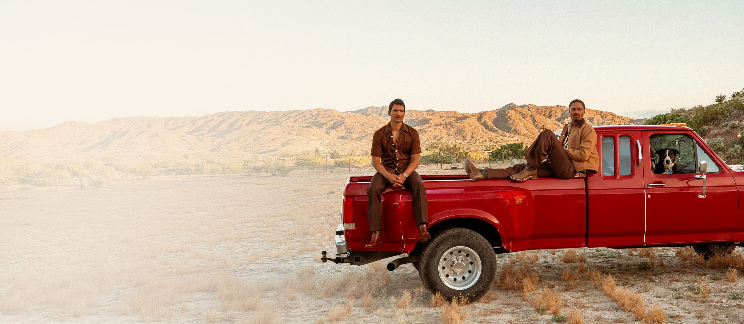Two men sitting on a truck wearing Signature Series boots and El Paso boots.